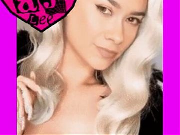AJ Lee shows her blonde hair wig with chin mole
